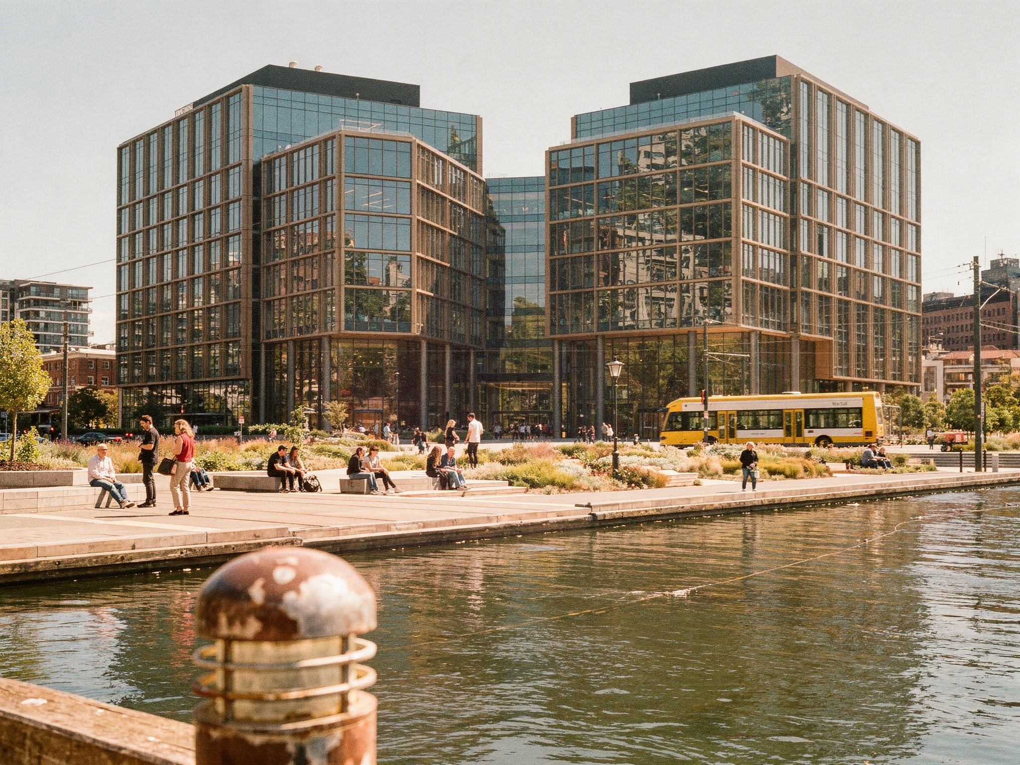 People sitting and walking on the plaza between the towers
