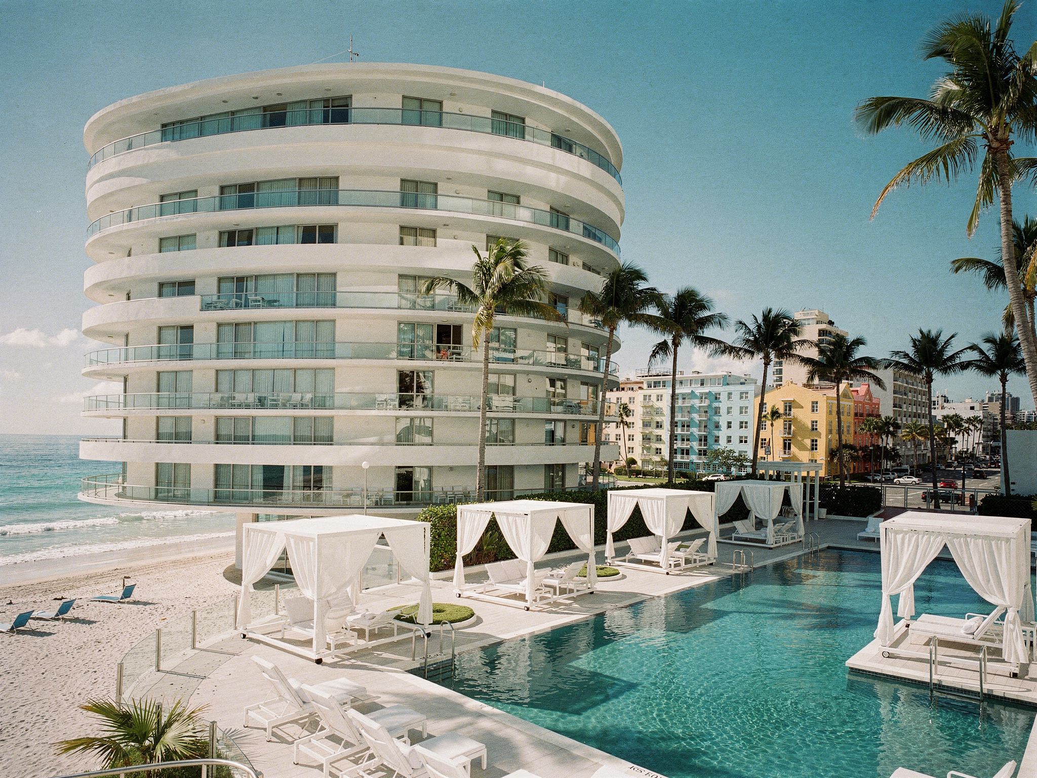 Saltline Hotel — curved white balconies above the Miami Beach pool deck